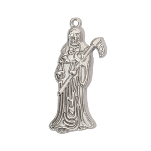 Macro shot of silver stainless steel Santa Muerte pendant with sharp engraved details
