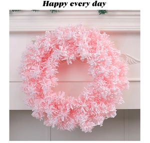Detailed view of pink and white plush fiber Christmas wreath decoration on white background