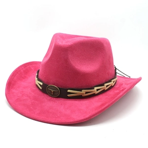 Detail of rose pink suede cowboy hat with bronze bull head emblem on brown leather band