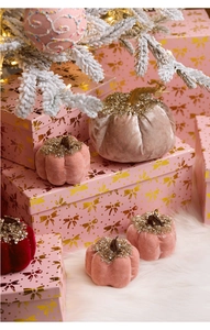 Close-up of luxury velvet pumpkins with gold glitter stems for Christmas decor