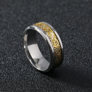 Polished stainless steel men's ring with gold dragon pattern inlay at 45-degree angle