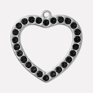 Macro shot of silver heart pendant with black rhinestones for DIY necklace jewelry