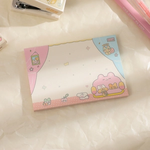 Detail of cartoon memo pad showing a cozy room scene with cute animal illustrations