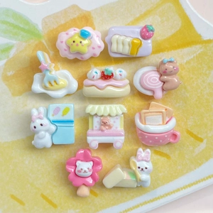 Flat lay of 10 mini resin cartoon bear and rabbit charms in soft macaron colors