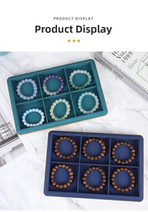 Detailed view of jewelry display trays with six compartments for organized storage