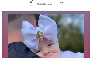 Detail of baby nylon headband with white satin bow and sparkling rhinestone centerpiece