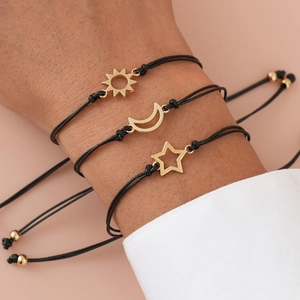 Three-piece adjustable friendship bracelets with sun moon star charms on wrist