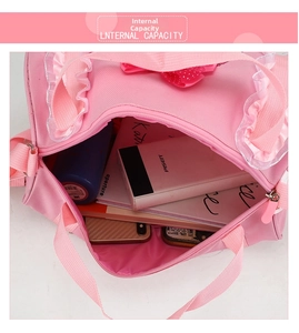 Pink dance bag interior showing capacity for water bottle, books and phone