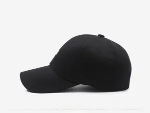 Side view of black structured cotton baseball cap with curved brim and embroidered detail