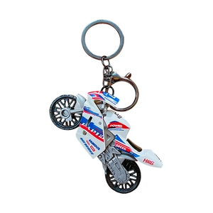 White sporty motorcycle keychain with red and blue racing decals and metal ring