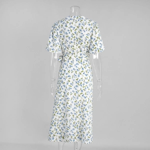 Detail of white floral cotton dress showing back V-neck and waist tie design