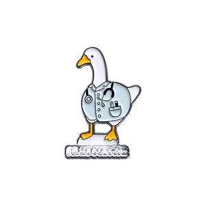 Detail view of cartoon enamel duck doctor pin featuring Trust Me I'm a Duckctor text