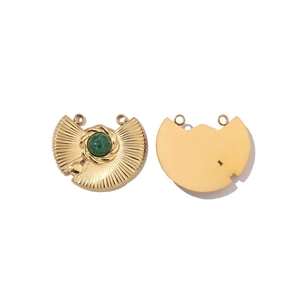 Detailed view of semi-circle gold pendants with green stones and radial textures