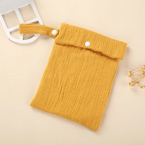 Ginger yellow crinkled baby diaper organizer bag with single button and hanging strap