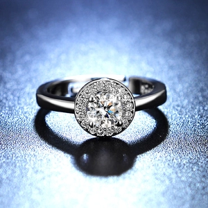 Macro detail of round brilliant moissanite ring with a sparkling diamond halo design