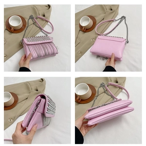 Detailed views of a pink rhinestone crossbody bag with elegant metal fringe and chain strap
