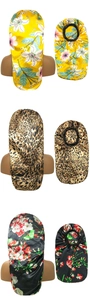 Detailed view of long satin sleep caps in floral and leopard prints for hair protection
