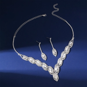 Close-up of sparkling marquise-cut crystal bridal necklace and drop earring set