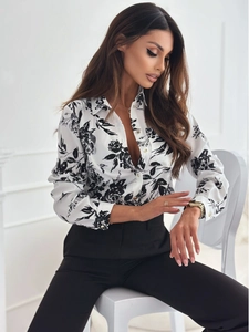 Detail of floral printed long sleeve shirt with classic collar and button-down front