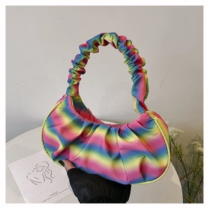 Detail of colorful rainbow pleated shoulder bag with elastic gathered handle design
