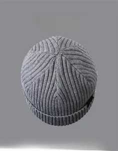 Close-up of ribbed knit pattern on winter beanie with multiple color options displayed