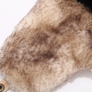 Detail of warm faux fur lining and vintage metal snap button on leopard winter hat