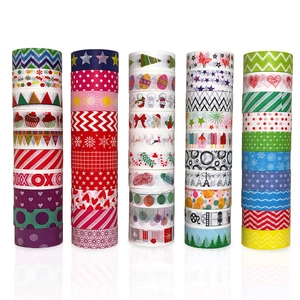 Stack of colorful decorative Washi tapes with festive Christmas and geometric DIY patterns