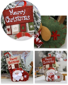 Detailed view of red and beige Christmas stockings with Santa and Snowman 3D dolls