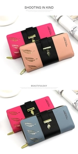 Detail of bifold long wallets for women with leaf pendant and tricolor patchwork design