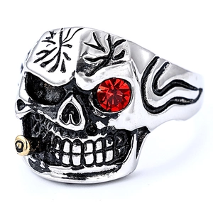 Gothic silver skull ring with red zircon eyes and gold pipe detail in stainless steel
