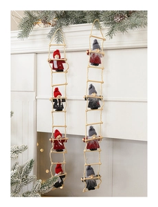 Close-up of felt Santa Claus dolls on rope ladders for Christmas tree and wall decor