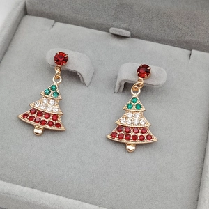 Sparkling Christmas tree stud earrings with colorful rhinestones in a grey jewelry box
