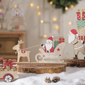 Creative wooden Christmas tree ornament with Santa Claus and reindeer on a rustic base