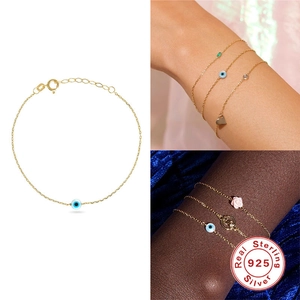 Gold plated S925 sterling silver Evil Eye charm bracelet with heart and flower pendants