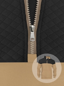 Detail of waffle-textured men's half-zip sweatshirt with quilted diamond pattern and contrast collar