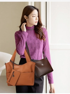 Detail of orange textured tote bag with kangaroo logo and matching mini zipper pouch