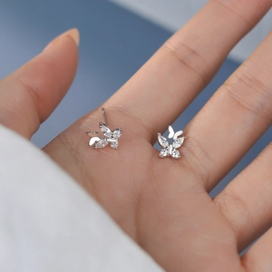 Sparkling zircon double butterfly earrings in S999 sterling silver shown on a hand