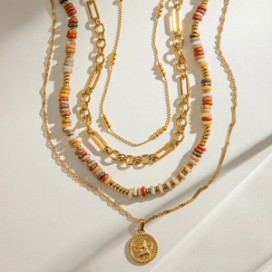 Layered gold necklace set with colorful stone beads and angel embossed pendant charm