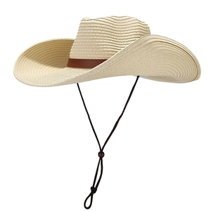 Chic cream-colored woven straw cowboy hat with a brown leather band and wind rope
