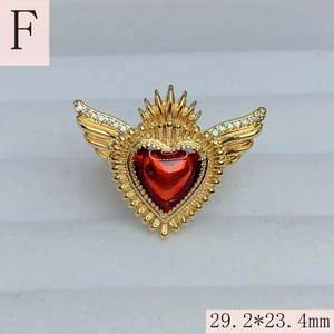 Macro shot of gold-plated red enamel heart wings ring showing dimensions 29.2x23.4mm