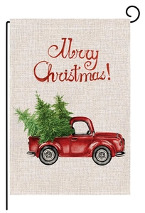 Detail of watercolor linen garden flag with vintage red truck and Christmas tree motif