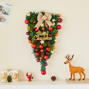 Teardrop Christmas wall hanging with red baubles, pine cones, and Merry Christmas sign