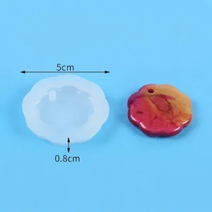 Detail of flower shaped silicone mold for resin pendants with 5cm diameter and 0.8cm thickness