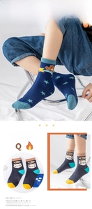Detail of baby cotton mid-calf socks with cute cartoon bear and star patterns
