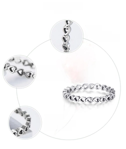 Detail showing polished S925 sterling silver hollow heart ring with oxidation finish