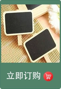 Close-up of mini wooden chalkboard signs with easel stands for desktop memos and seat cards