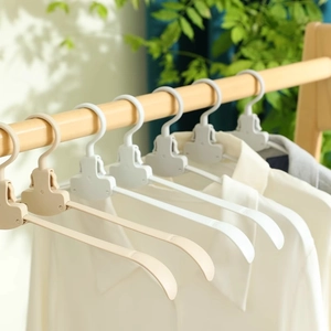 Portable wide-shoulder folding hangers in beige and white for non-slip garment storage