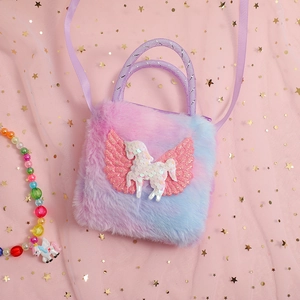 Close-up of plush unicorn shoulder bag with pink purple gradient and sequin Pegasus design