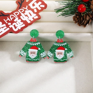Close-up of green sweater shaped acrylic Christmas earrings with Santa Claus pattern