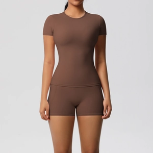 Mocha brown two-piece yoga set with short sleeve top and high-waisted shorts